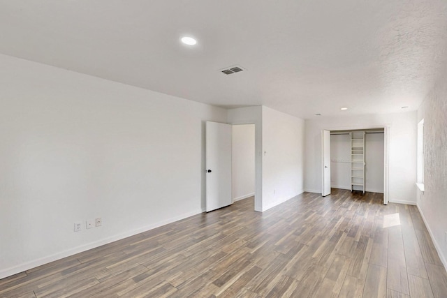 3965 Singleleaf Ln, Fort Worth, TX 76133 - unfurnished bedroom with wood finished floors, baseboards, a closet, and recessed lighting