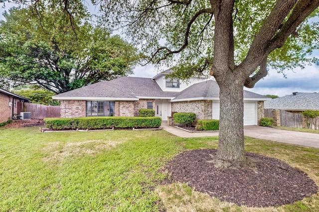 view of front of property featuring a front lawn, fence, brick siding, concrete driveway, and an attached garage