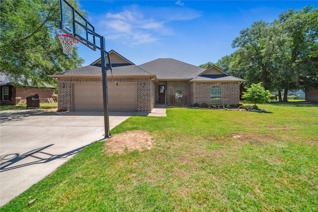 single story home featuring an attached garage, a front yard, brick siding, and concrete driveway