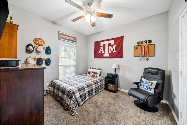 carpeted bedroom with baseboards and ceiling fan