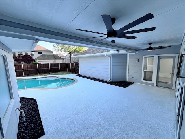 view of swimming pool with a fenced backyard, a ceiling fan, a fenced in pool, and a patio area