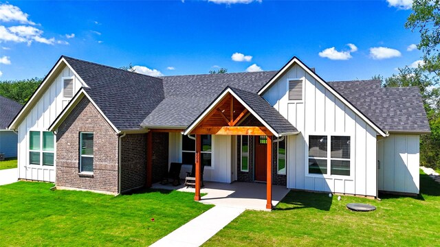 5008 San Marcos Dr, Granbury, TX 76048 - modern farmhouse style home with board and batten siding, a shingled roof, and a patio area