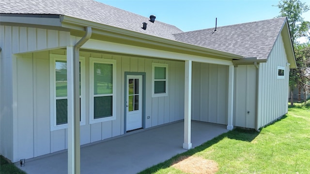 5008 San Marcos Dr, Granbury, TX 76048 - back of house with a patio area, a shingled roof, a lawn, and board and batten siding