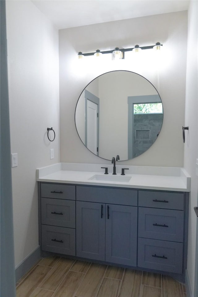 5008 San Marcos Dr, Granbury, TX 76048 - bathroom featuring vanity and wood finish floors
