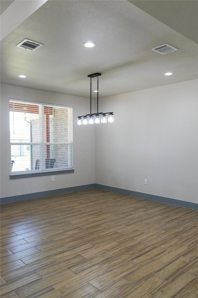 5008 San Marcos Dr, Granbury, TX 76048 - spare room featuring wood finished floors, baseboards, and recessed lighting