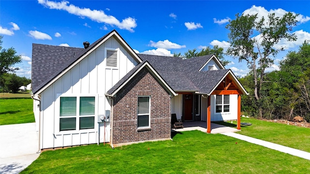 5008 San Marcos Dr, Granbury, TX 76048 - view of front of property with board and batten siding, a shingled roof, a front yard, a patio area, and brick siding