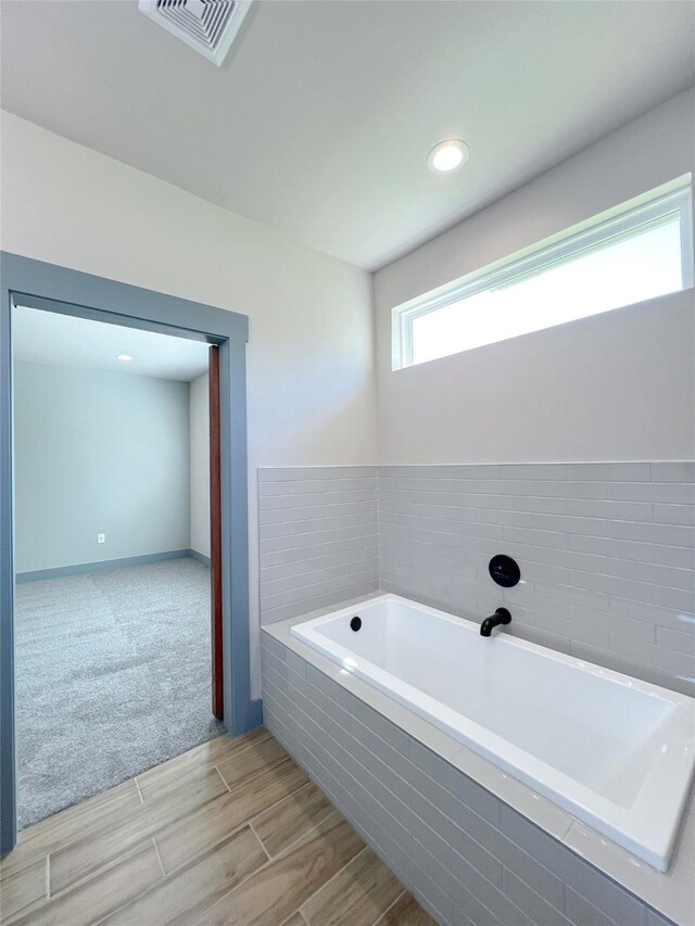 5008 San Marcos Dr, Granbury, TX 76048 - full bath with a bath and wood finished floors