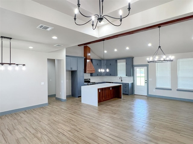 5008 San Marcos Dr, Granbury, TX 76048 - kitchen featuring a chandelier, light countertops, stainless steel electric range oven, vaulted ceiling, and a kitchen island