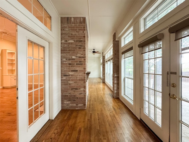 1520 Gatewood Dr, Denton, TX 76205 - corridor featuring wood-type flooring, brick wall, and french doors
