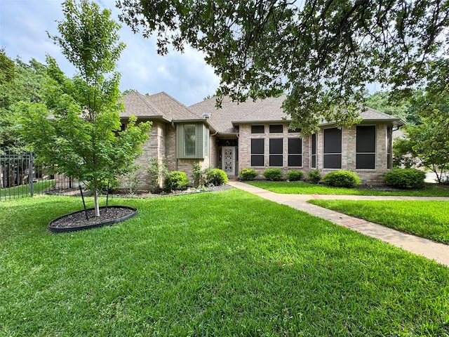 1520 Gatewood Dr, Denton, TX 76205 - view of front of house featuring a front lawn and a shingled roof