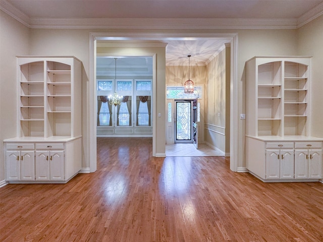 1520 Gatewood Dr, Denton, TX 76205 - unfurnished dining area with a chandelier, light wood-type flooring, ornamental molding, and baseboards