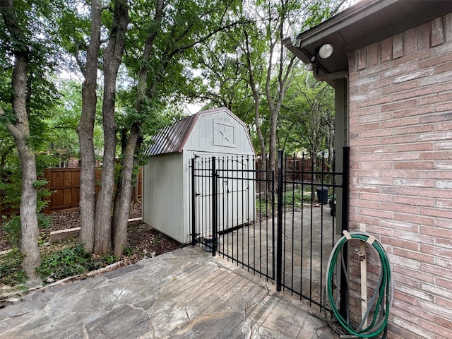 1520 Gatewood Dr, Denton, TX 76205 - gate with fence, a shed, and an outbuilding