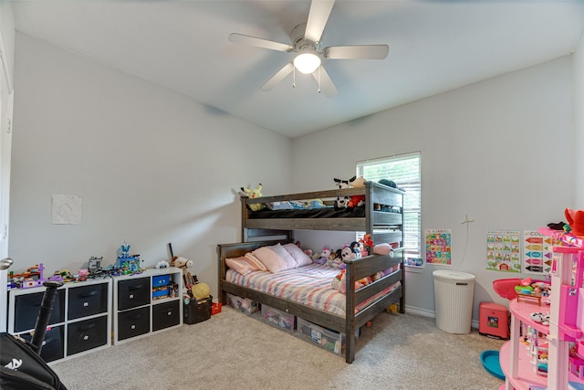 bedroom featuring a ceiling fan and carpet