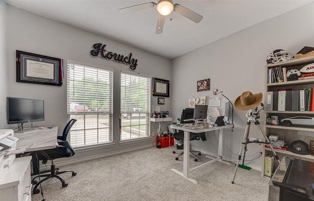 office area featuring carpet floors, baseboards, and a ceiling fan