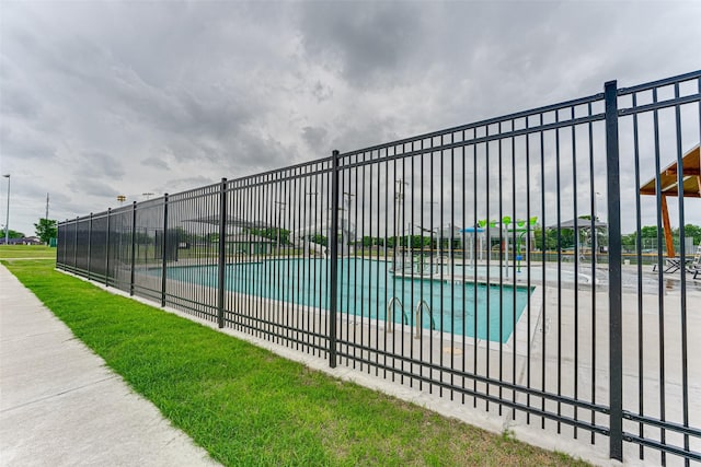 community pool featuring fence
