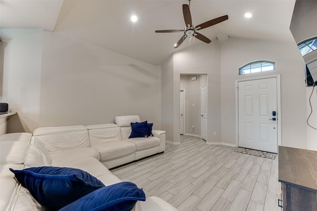 living area with ceiling fan, high vaulted ceiling, baseboards, light wood finished floors, and recessed lighting