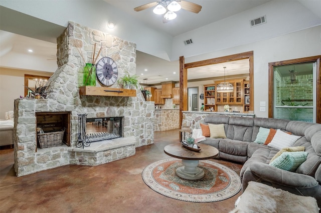 1320 Fox Ln, Burleson, TX 76028 - living area featuring ceiling fan, concrete flooring, a stone fireplace, and visible vents