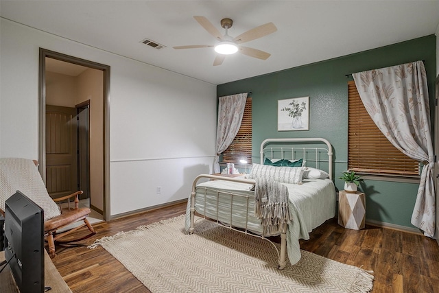 1320 Fox Ln, Burleson, TX 76028 - bedroom with ceiling fan, visible vents, and wood finished floors