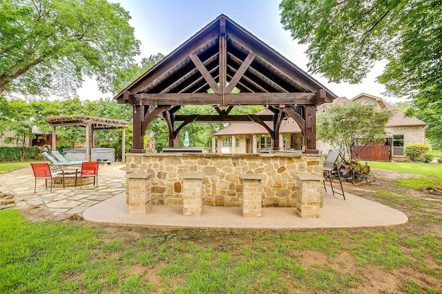 1320 Fox Ln, Burleson, TX 76028 - view of patio / terrace featuring a hot tub, a gazebo, and outdoor dry bar