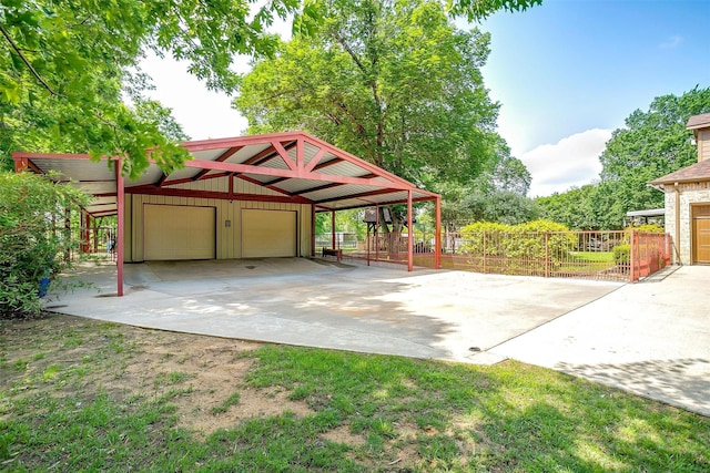 1320 Fox Ln, Burleson, TX 76028 - exterior space featuring board and batten siding, fence, an outdoor structure, and a garage