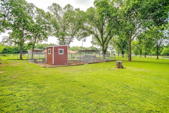 1320 Fox Ln, Burleson, TX 76028 - view of yard featuring exterior structure, fence, an outbuilding, and a carport