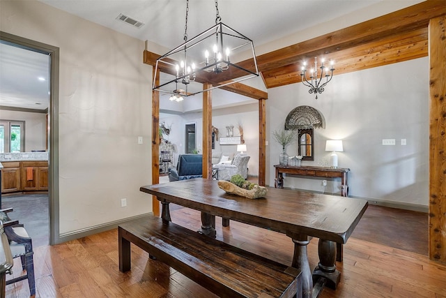1320 Fox Ln, Burleson, TX 76028 - dining space featuring baseboards, an inviting chandelier, light wood-style flooring, and visible vents