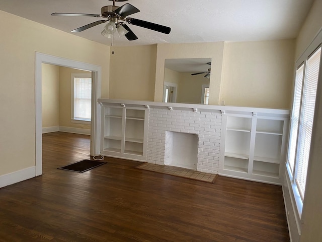 unfurnished living room with baseboards, ceiling fan, and wood finished floors