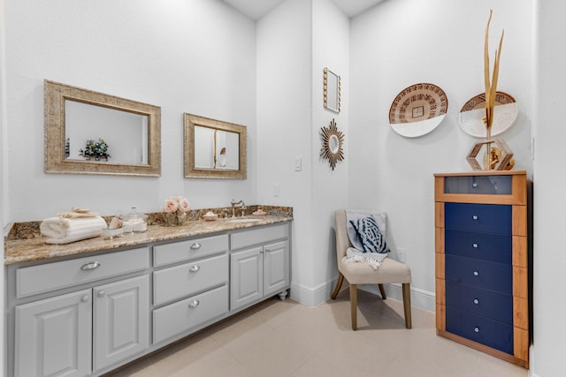 7242 Waters Edge Dr, The Colony, TX 75056 - bathroom with vanity, baseboards, and tile patterned flooring