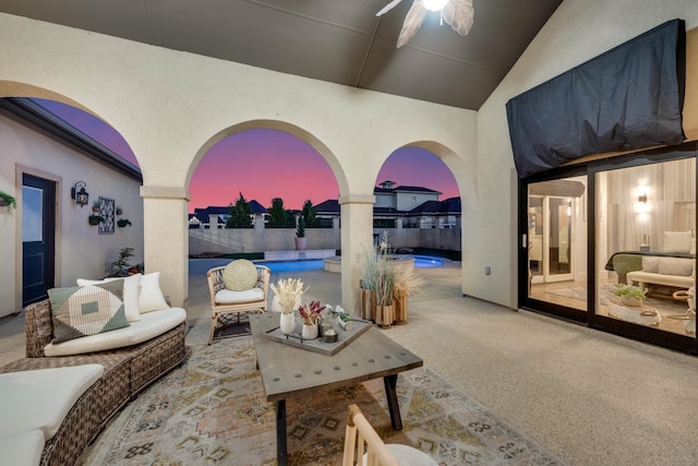 7242 Waters Edge Dr, The Colony, TX 75056 - patio terrace at dusk with fence, ceiling fan, an outdoor living space, and a fenced in pool