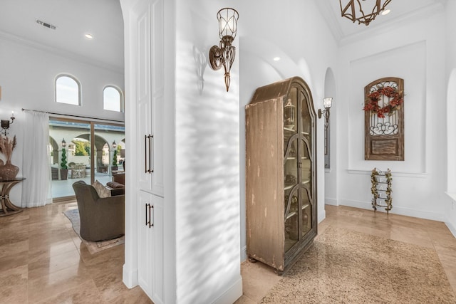 7242 Waters Edge Dr, The Colony, TX 75056 - corridor featuring arched walkways, ornamental molding, visible vents, and a towering ceiling