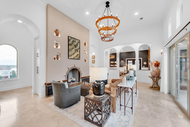 7242 Waters Edge Dr, The Colony, TX 75056 - living room featuring an inviting chandelier, arched walkways, baseboards, and recessed lighting