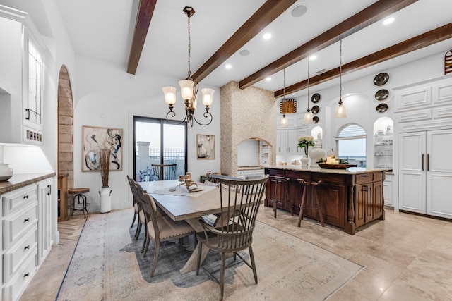 7242 Waters Edge Dr, The Colony, TX 75056 - dining room with arched walkways, beamed ceiling, recessed lighting, and a notable chandelier