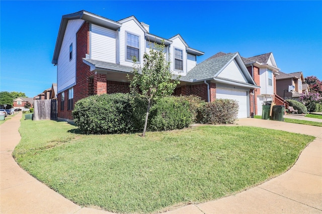 view of front of house featuring brick siding, a garage, driveway, and a front yard