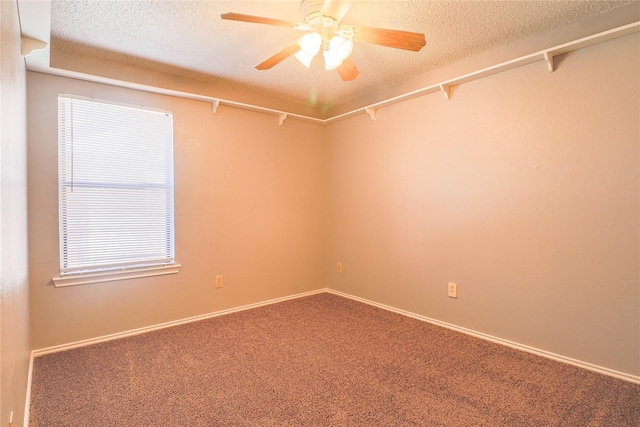 unfurnished room with baseboards, a textured ceiling, ceiling fan, and carpet