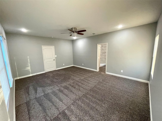 2025 Eva St, Grand Prairie, TX 75051 - unfurnished room with dark colored carpet, baseboards, a ceiling fan, and recessed lighting