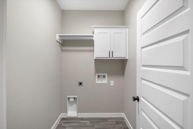 clothes washing area featuring baseboards, hookup for an electric dryer, wood tiled floor, and hookup for a washing machine