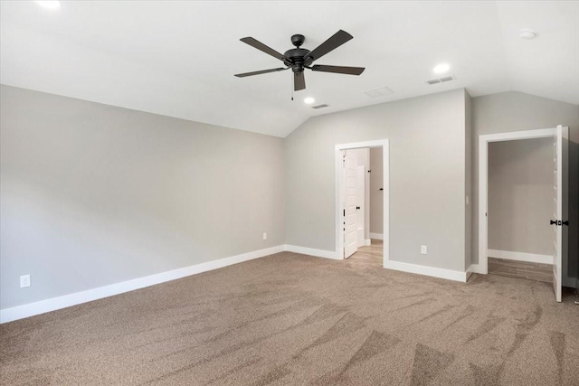 unfurnished bedroom with visible vents, baseboards, recessed lighting, carpet, and vaulted ceiling