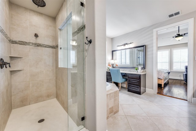 bathroom with visible vents, ensuite bathroom, tile patterned floors, a bath, and a stall shower