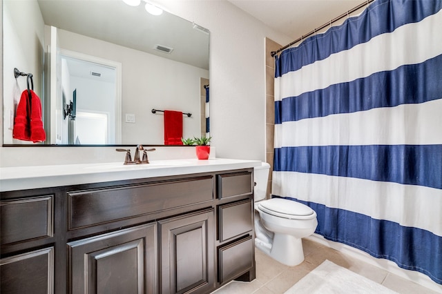 bathroom featuring visible vents, tile patterned flooring, vanity, toilet, and a shower with shower curtain