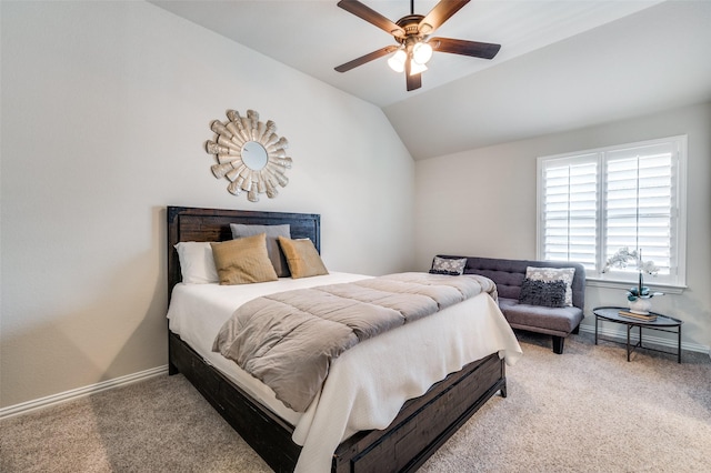 carpeted bedroom with a ceiling fan, baseboards, and lofted ceiling