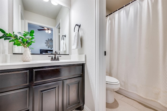 full bath featuring a shower with curtain, ceiling fan, tile patterned flooring, vanity, and toilet