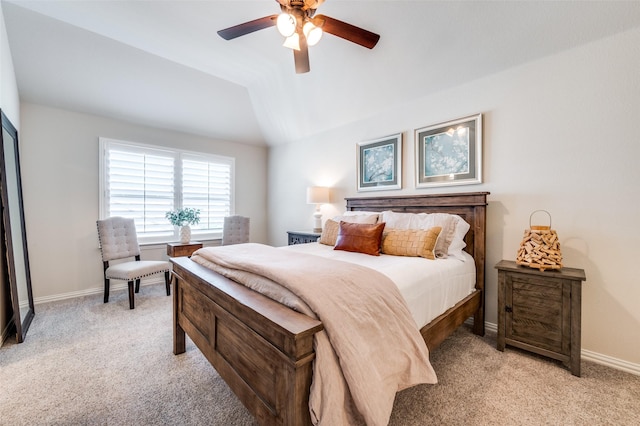 bedroom with a ceiling fan, baseboards, light carpet, and lofted ceiling