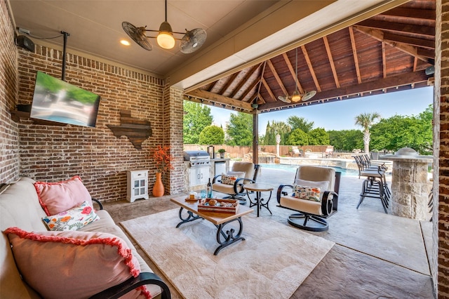 view of patio / terrace with fence, a gazebo, area for grilling, a fenced in pool, and a ceiling fan