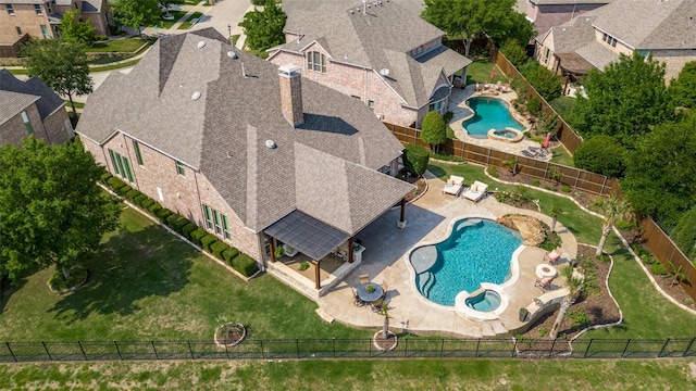 birds eye view of property with a residential view