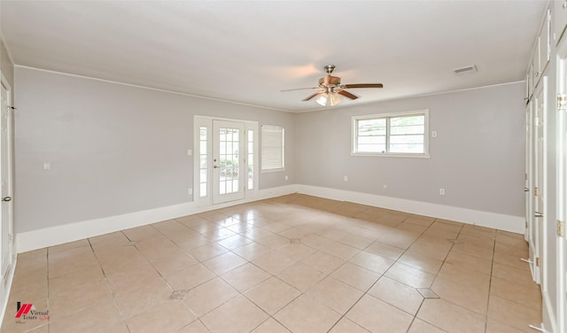 empty room featuring french doors, a ceiling fan, baseboards, light tile patterned floors, and visible vents
