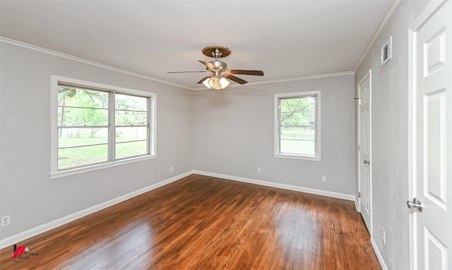 unfurnished room featuring crown molding, a ceiling fan, dark wood-type flooring, and visible vents