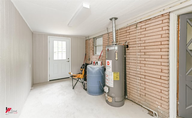 utility room with gas water heater