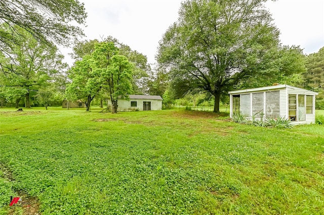 view of yard with a sunroom