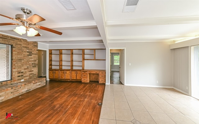unfurnished living room featuring visible vents, ceiling fan, beam ceiling, and wood finished floors