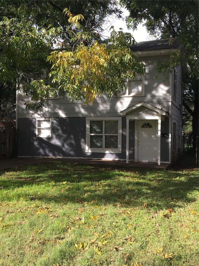 back of house with a yard